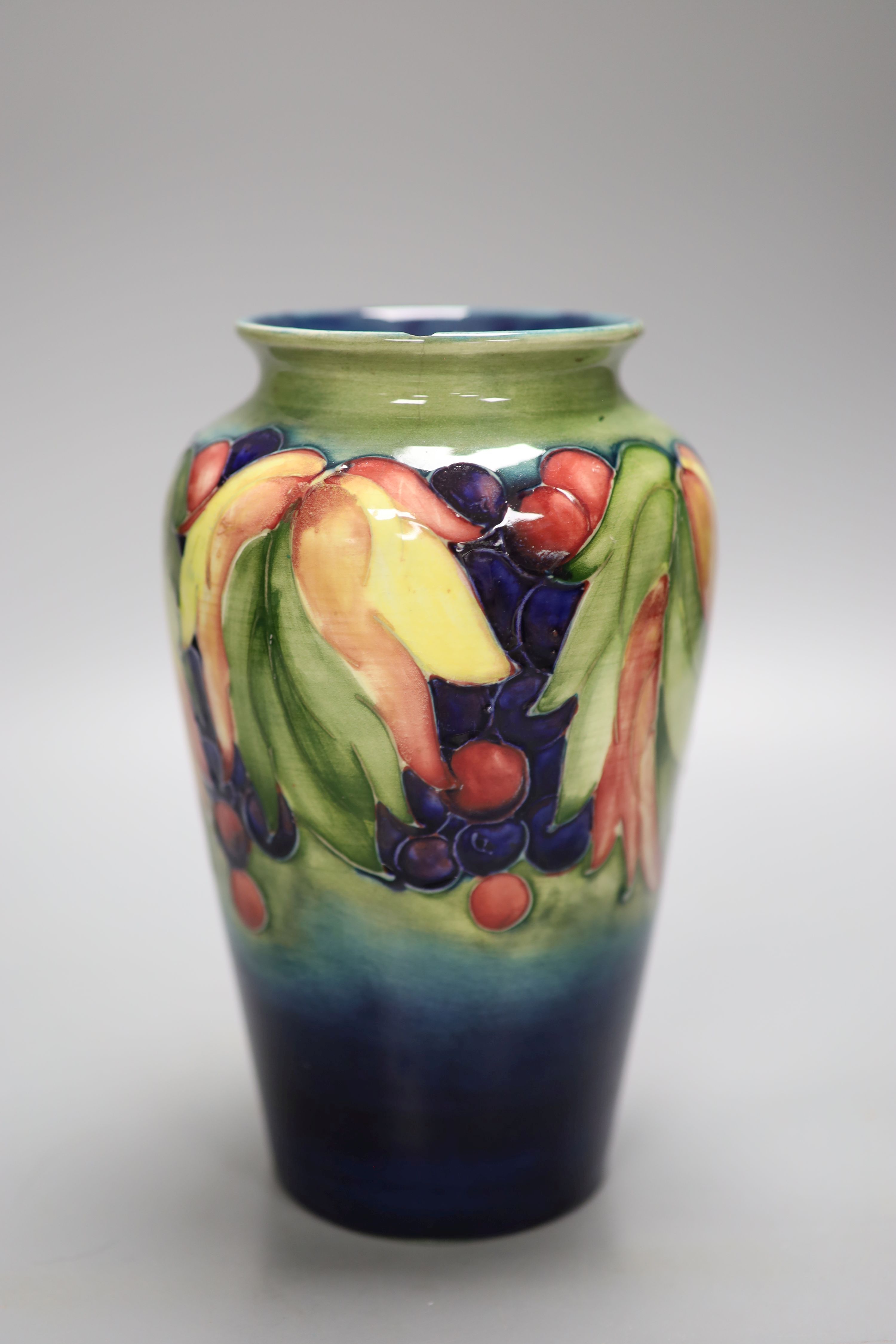 A Moorcroft leaf and berry vase, height 21cm